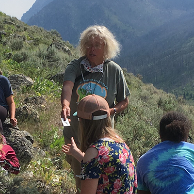 An Image of Dorothy Tuthill with students in the field